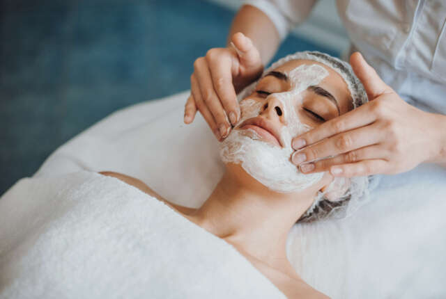 Close-up portrait of anorganic facial mask application at spa salon. Facial treatment. Skin care. Health care. Rejuvenation treatment.